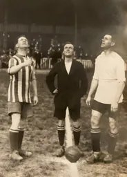 Luton skipper Alf Tirrell tosses the coin watched by Gills' Charlie Freeman