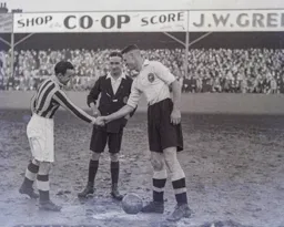 Skipper Jack Nelson greets his Blackpool counterpart before the start