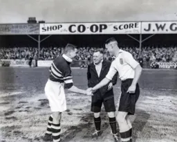 Skipper Jack Nelson greets his Northampton counterpart - former Hatter Bill Thayne