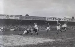 Bert Dawes slips the ball home