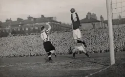 Bernard Streten holds on to a cross