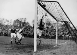Iorwerth Hughes tips the ball over