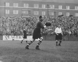 Bernard Streten about to clear the ball