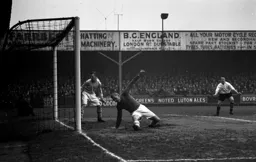 Bert Trautmann the City keeper is beaten and Mike Cullen looks pleased about it