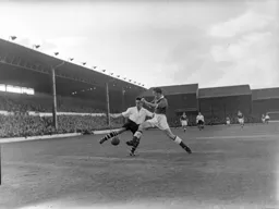 Joe Scott attempts to hook the ball past a defender