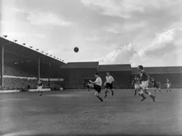 Joe Scott knocks the ball up in the air