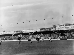 George Cummins heads the ball into the path of Joe Scott