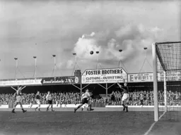 George Cummins watches as a high ball drops into the goal mouth