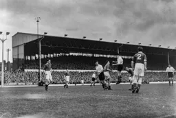 Johnny Downie heads the ball down into the path of Joe Scott