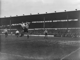 Jesse Pye wins this heading duel with Wally Bragg