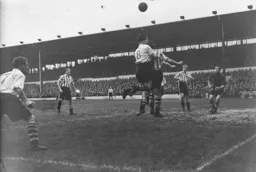 The ball is just too high for Johnny Downie