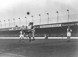 Gordon Turner goes in for a heading duel