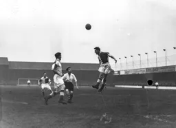 George Cummins looks on as a Rovers defender heads the ball clear