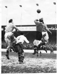 Bernard Streten punches the ball away