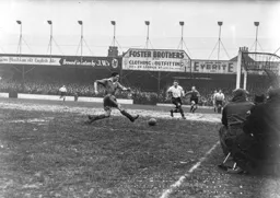 Bernard Streten is out of position but Syd Owen covers any threat from Stan Mortensen