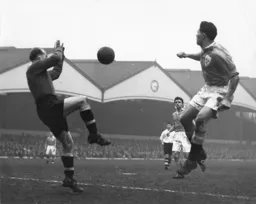 Bernard Streten saves from Blackpool`s Bill Perry