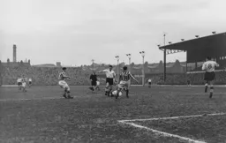 A sliding tackle stops Johnny Downie in his tracks