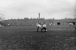 Gordon Turner just manages to get a shot at goal