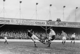 Rovers keeper Ken Hardwick appears to make a conventional tackle on Gordon Turner