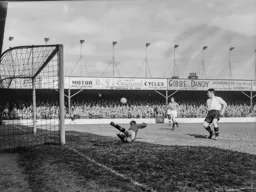 Johnny Downie watches as the ball flashes across the goal mouth