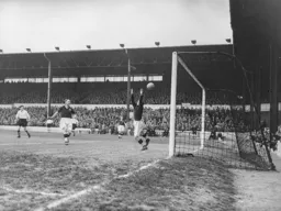 Bob Morton`s shot is too fierce for Terry Webster to handle as the Town go 1-0 up