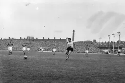 Bob Morton plays the ball across the penalty area