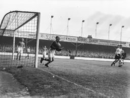 John Groves looks on as Harry Walker gathers the ball