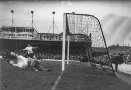 Jimmy Adam watches Gordon Turner`s effort register the Town`s third goal