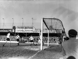 Gordon Turner, John Groves and Jimmy Adam watch as the ball drifts harmlessly wide