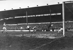 Roy Davies slams the ball into the net for his second goal of the afternoon and Town`s fifth