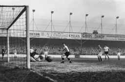 Bob Morton watches Roy Davies shot go wide