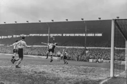 David Teece fists the ball clear from Bob Morton