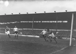 Mick Cullen races in as Jack Parry fails to control the ball