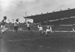 Gordon Turner`s shot is blocked by Doug Rees