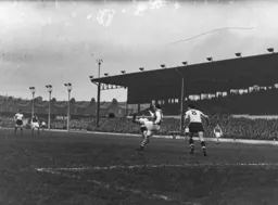 Gordon Turner watches as Doug Rees clears the ball downfield