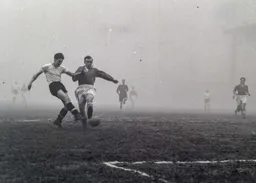Gordon Turner goes for goal at a fogbound Kenilworth Road