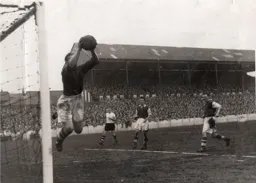 The Rotherham keeper safely gathers the ballas Roy Davies watches from distance