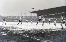 Bob Morton jumps in but the ball is headed clear