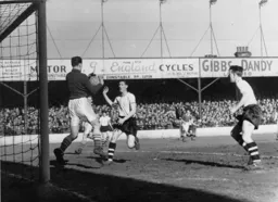 John Groves closes in as Fulham keeper Ian Black gathers the ball