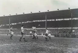 Bob Morton sends a powerful header towards the goal