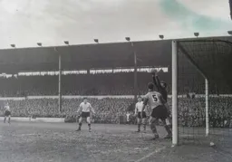 Gordon Turner and Jimmy Adam can only weatch as Roy Wood safely catches the ball