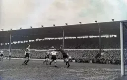 John Groves ducks as Roy Wood snatches at the ball