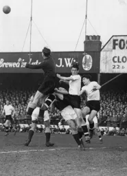 Hammers keeper George Taylor punches the ball clear from John Groves