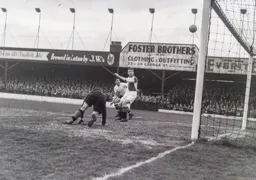 A goal surely, but no as Jim Pemberton watches the flight of the ball