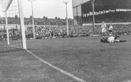 The ball beats the photographer and Ted Ditchburn. The ball is in the net and Gordon Turner has scored Town`s second goal
