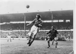 Preston`s Joe Walton heads the ball clear