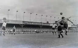 Jimmy Adam attempts to head the ball back to Gordon Turner