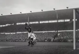 George Farm has the ball in his hands before Jimmy Adam can react