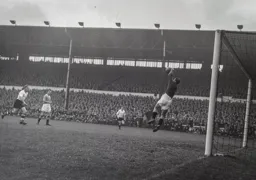 Peter MacEwan looks on as George Farm makes a save