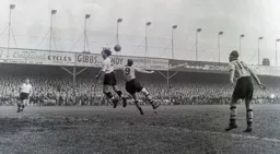 Jim Pemberton and Roy Swinbourne compete in a heading duel